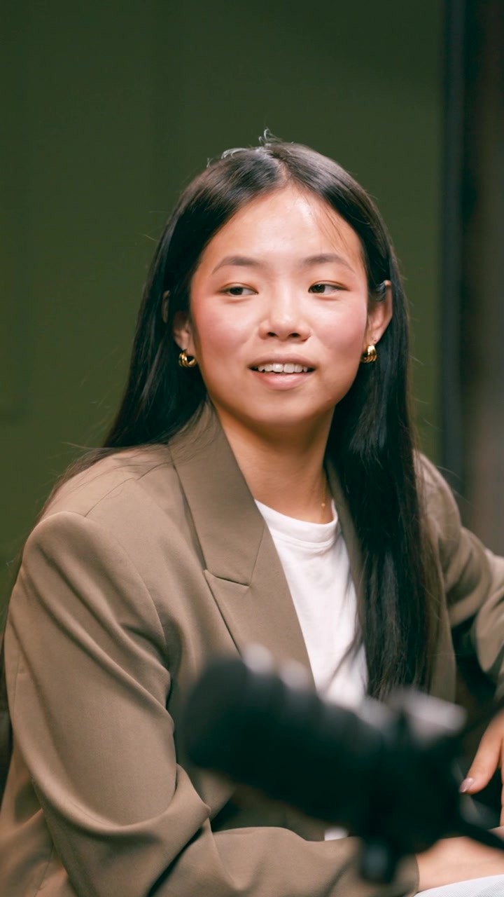 Young Asian Woman Participating in a Professional Discussion