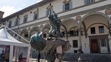 a fountain in front of a historic building