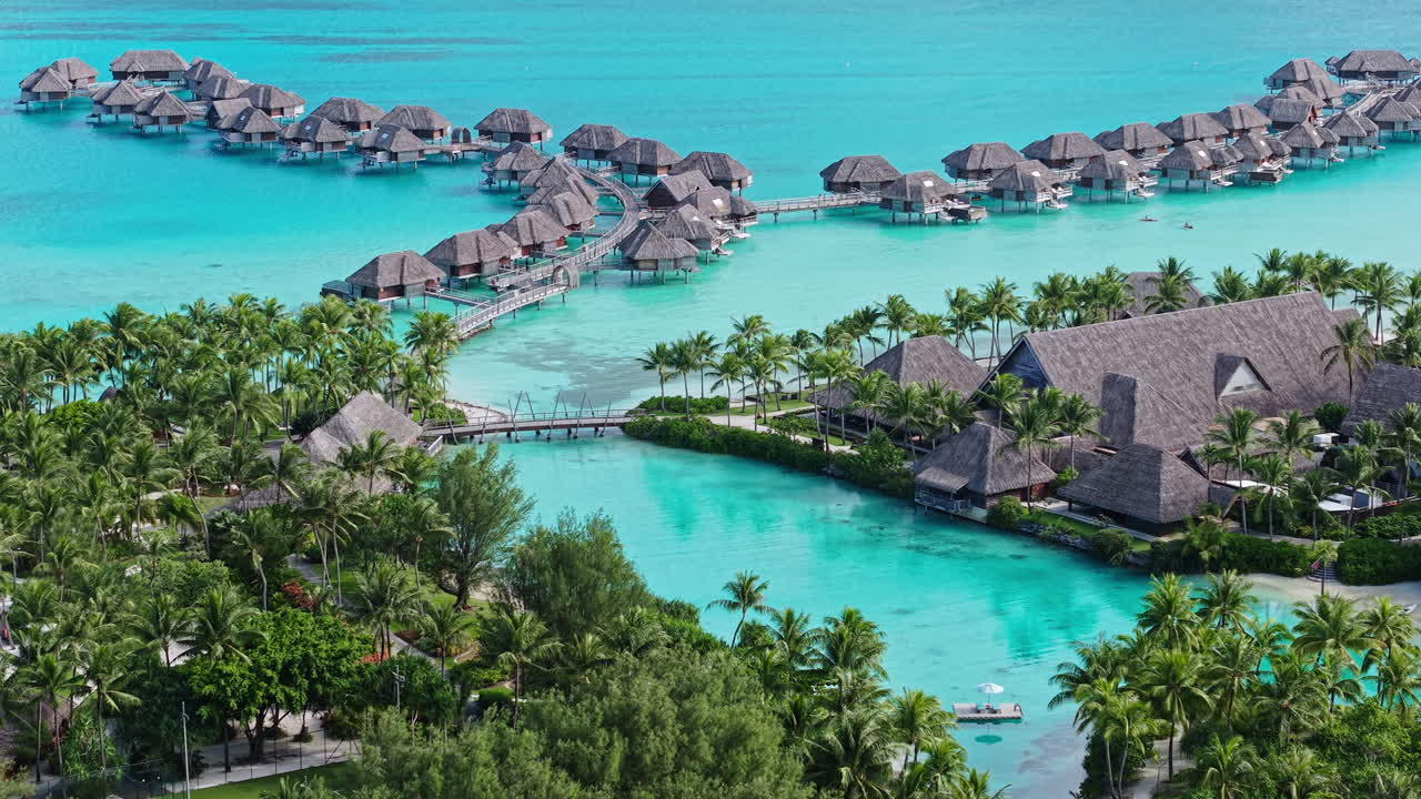 Bora Bora Island, French Polynesia. Aerial View of Luxury Resort Villas Over Turquoise Water of Lagoon