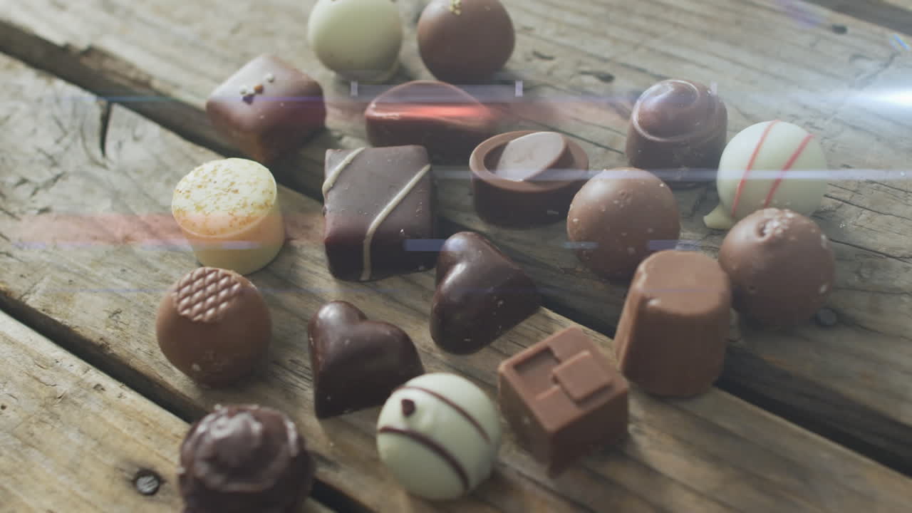 animación de la luz sobre pralinas de chocolate en superficie de madera