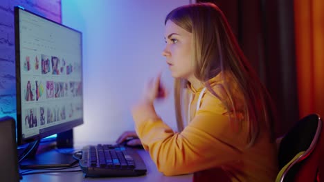 woman using computer. young woman sitting at table and using computer