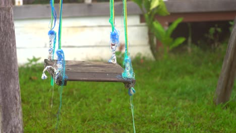 Rustic-abandoned-swing.--Wooden-swing-with-ropes