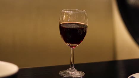 a wine glass on a table