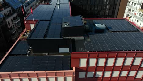 drone flies over solar panels on environmentally-friendly public structure