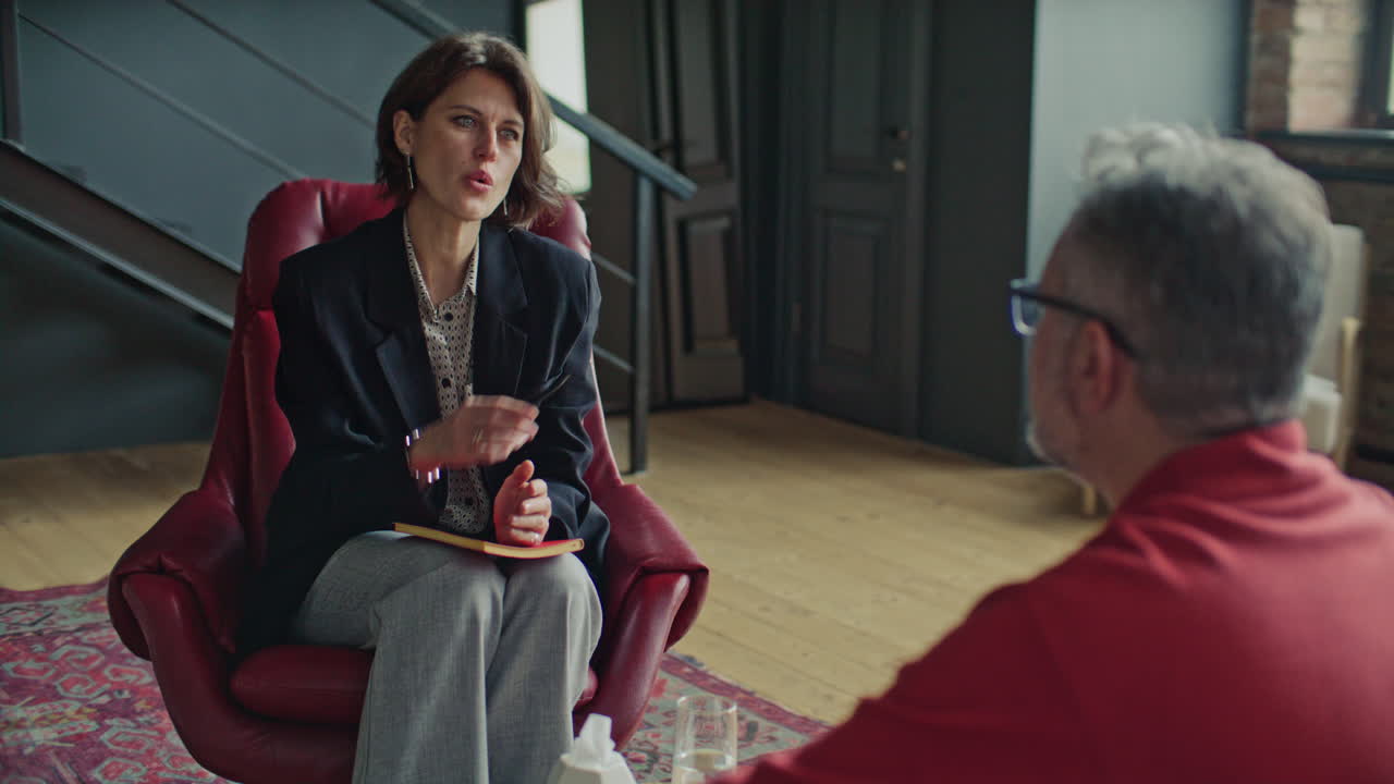 Female Therapist Giving Advice to Patient during Counseling Session