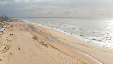 slow panning drone shot of the beach in zandvoort netherlands