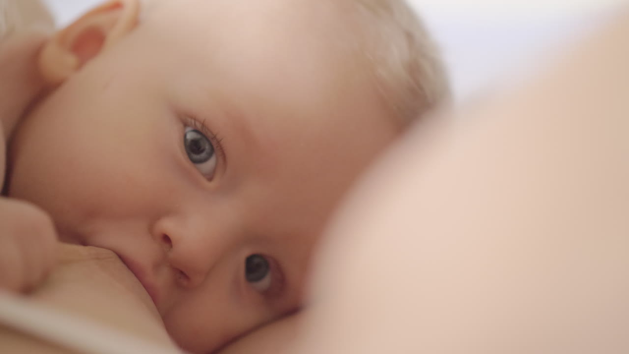 Nursing baby daughter