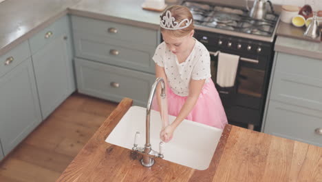 girl, child washing and hands with soap in kitchen