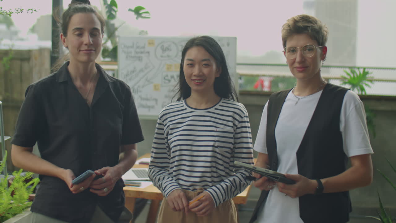 A group of diverse businesswomen collaborating in a modern office space
