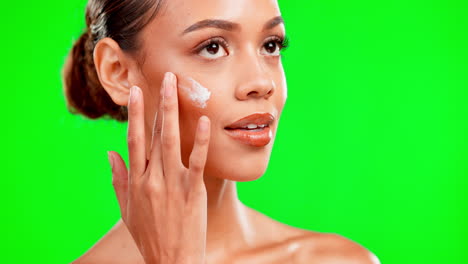 mujer, crema hidratante para el cuidado de la cara y la piel en verde