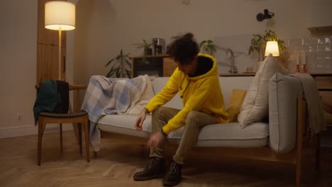 person putting on shoes at home