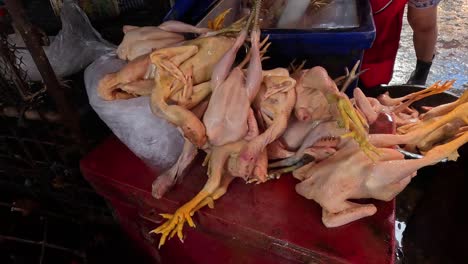 customers picking chickens at a wet market