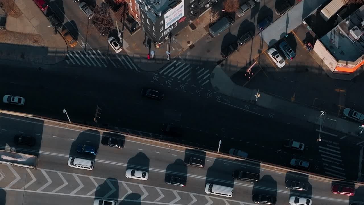 Busy street in New York with cars moving along in afternoon light