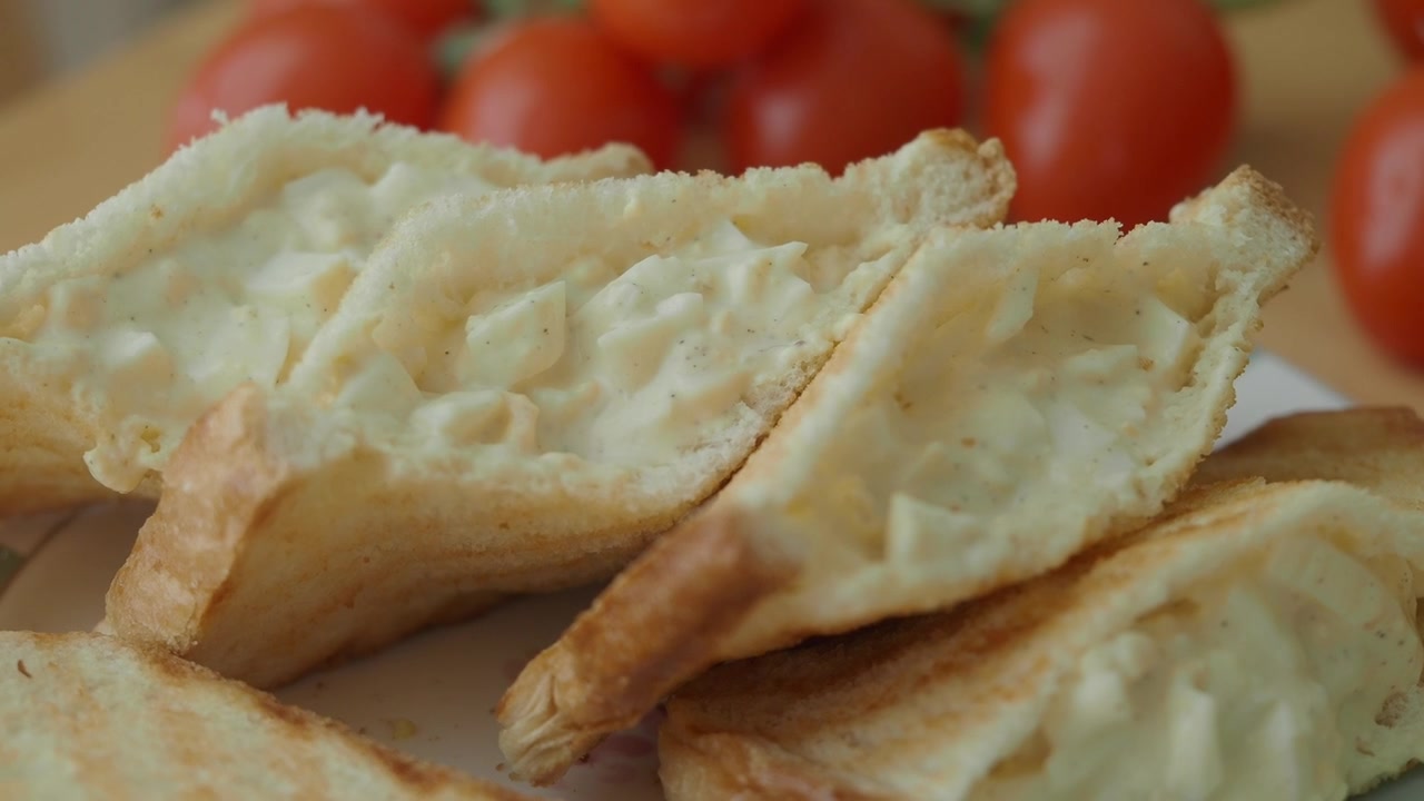 Close-up of Toasted Egg Salad Sandwiches with Cherry Tomatoes