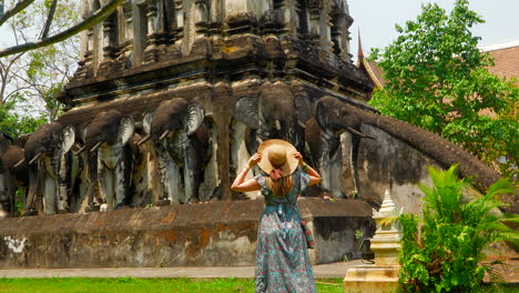 Tourist-woman-with-hat-posing-for-a-picture-in-Wat-Chiang-Man-temple