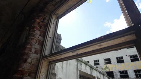 broken window in abandoned scary place - close up - urban exploration