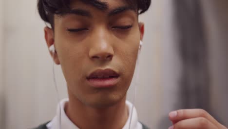 transgender adult listening to music in the street