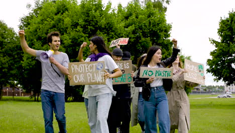 group of  people in a protest with megaphones and placards 6