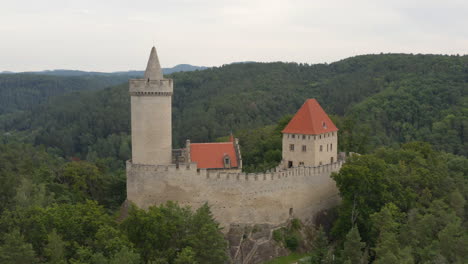 stone medieval castle of kokorin with keep in forests of czechia