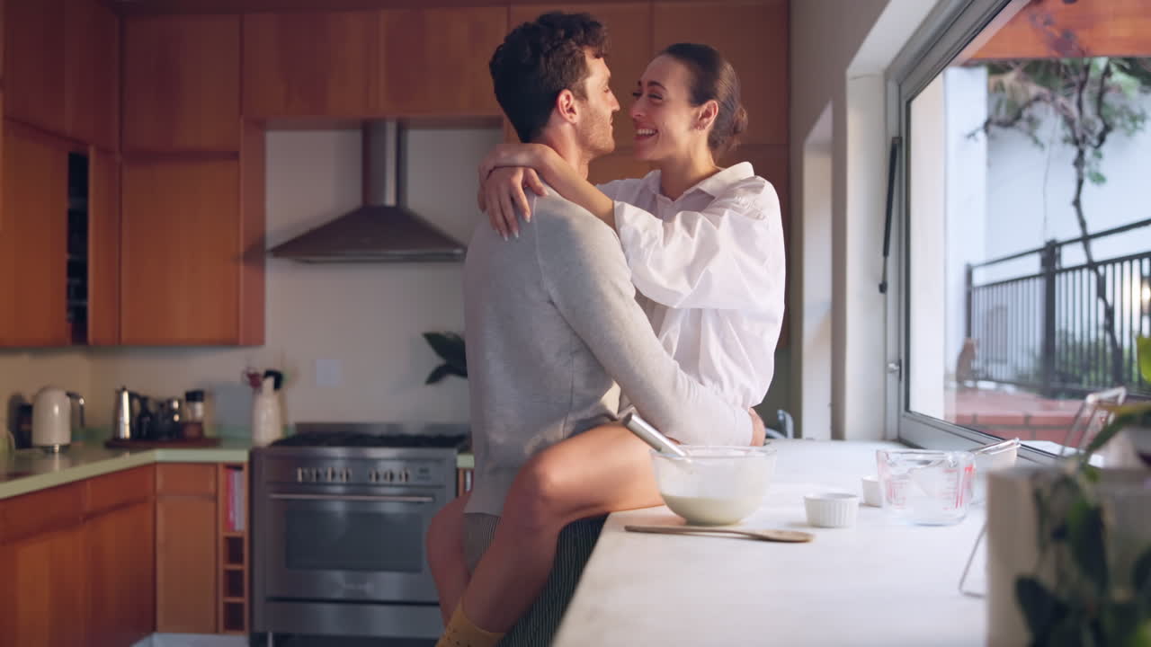 Kiss, love or couple in kitchen for romance