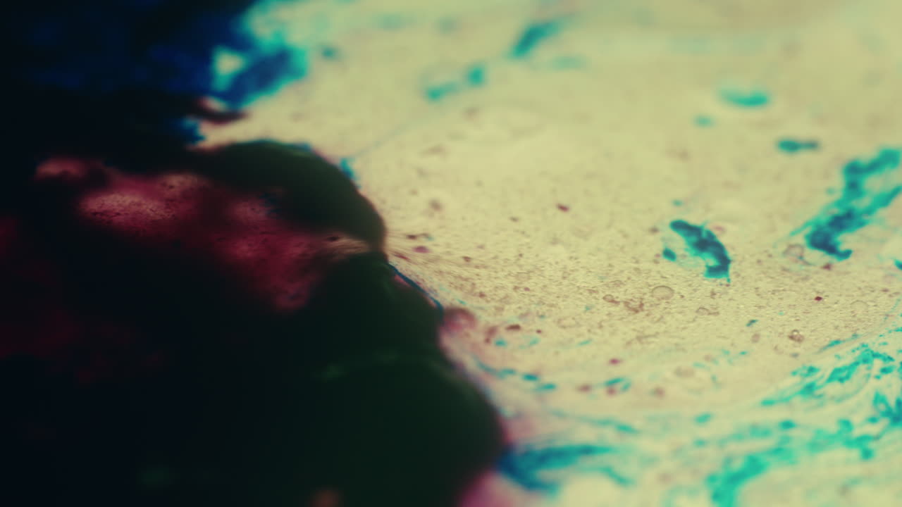 Colourful, organic, liquids macro shots buzzing and flowing