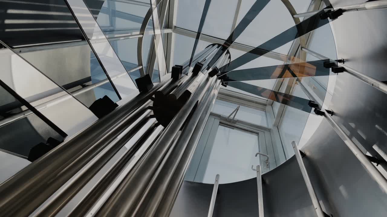 Designer spiral staircase in high-tech style leading to the roof of the house