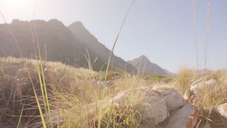 Landscape-of-beautiful-mountains-and-grass-with-blue-sky-on-sunny-day,-in-slow-motion