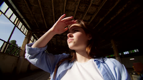 young woman in an abandoned factory