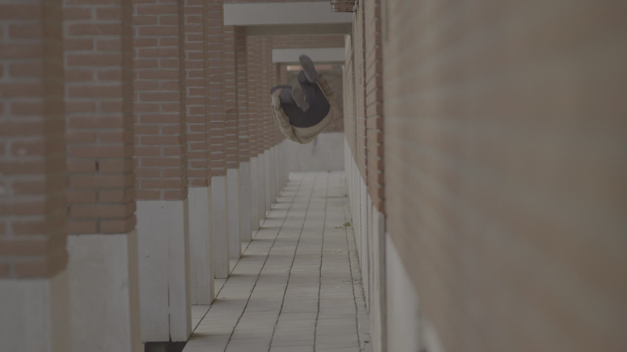 Man Running Down a Brick Pathway
