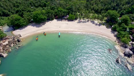 Drop-down-view-of-empty-luxury-beach-in-Phuket,-Thailand-in-Southeast-Asia