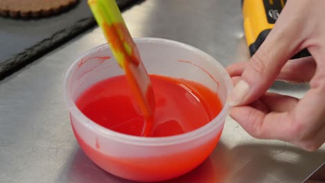 decorating gingerbread cookies with red icing