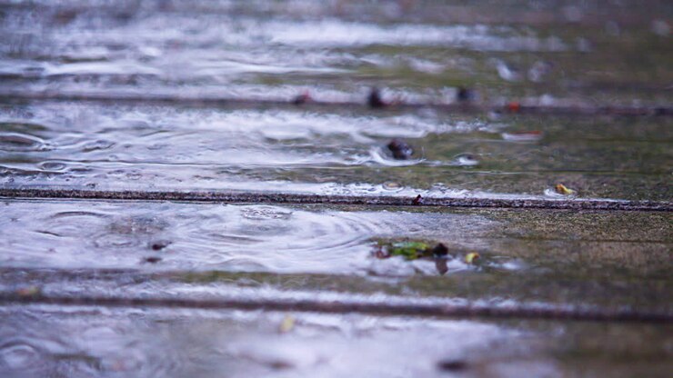 Steady Rain Falling on Deck - Close-Up