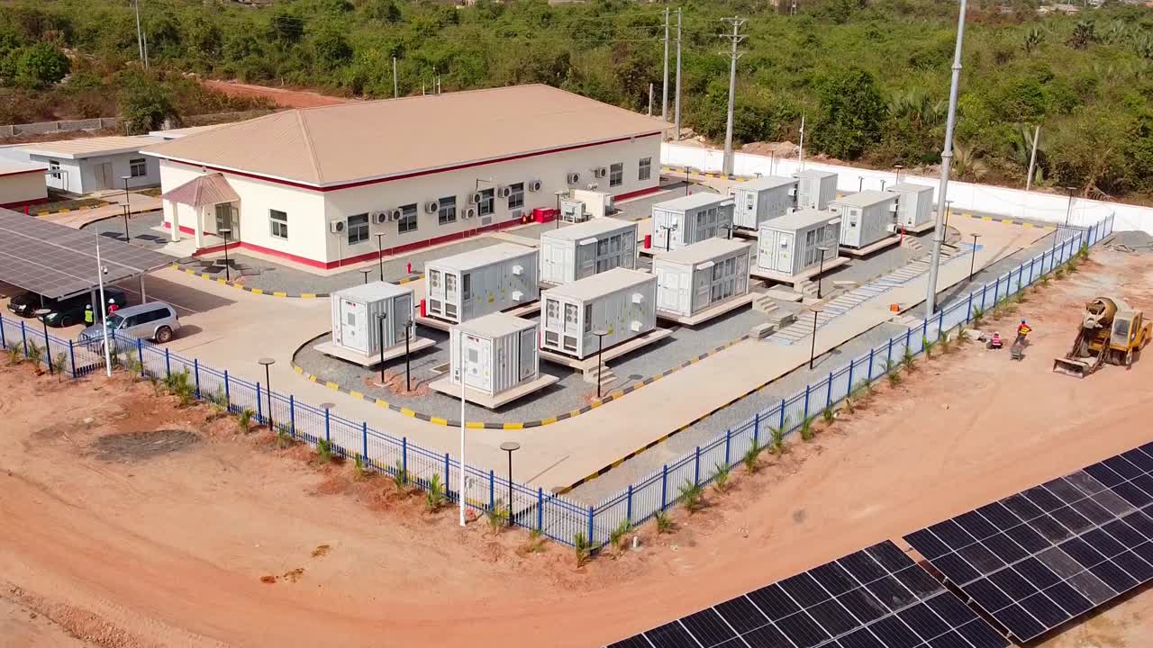 Aerial high descending overview the battery energy storage system BESS at Jambur PV plant