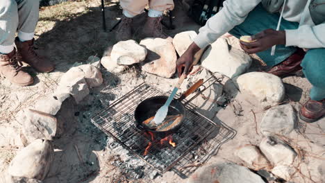 cooking fish on a campfire