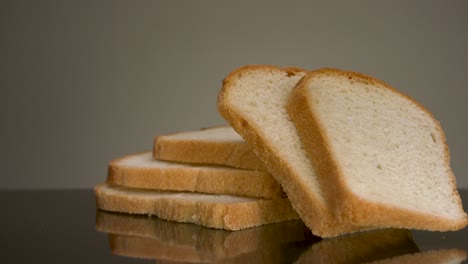 hand picking up slices of bread