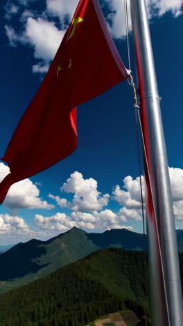 chinese flag flying over mountainous landscape