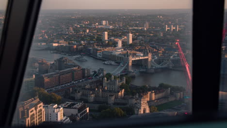 aerial view of london at sunset: tower bridge and tower of london