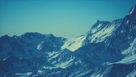 aerial view of the alps mountains in snow
