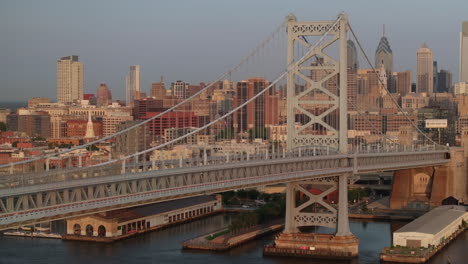 establishing shot of philadelphia's ben franklin bridge. shot on a summer morning