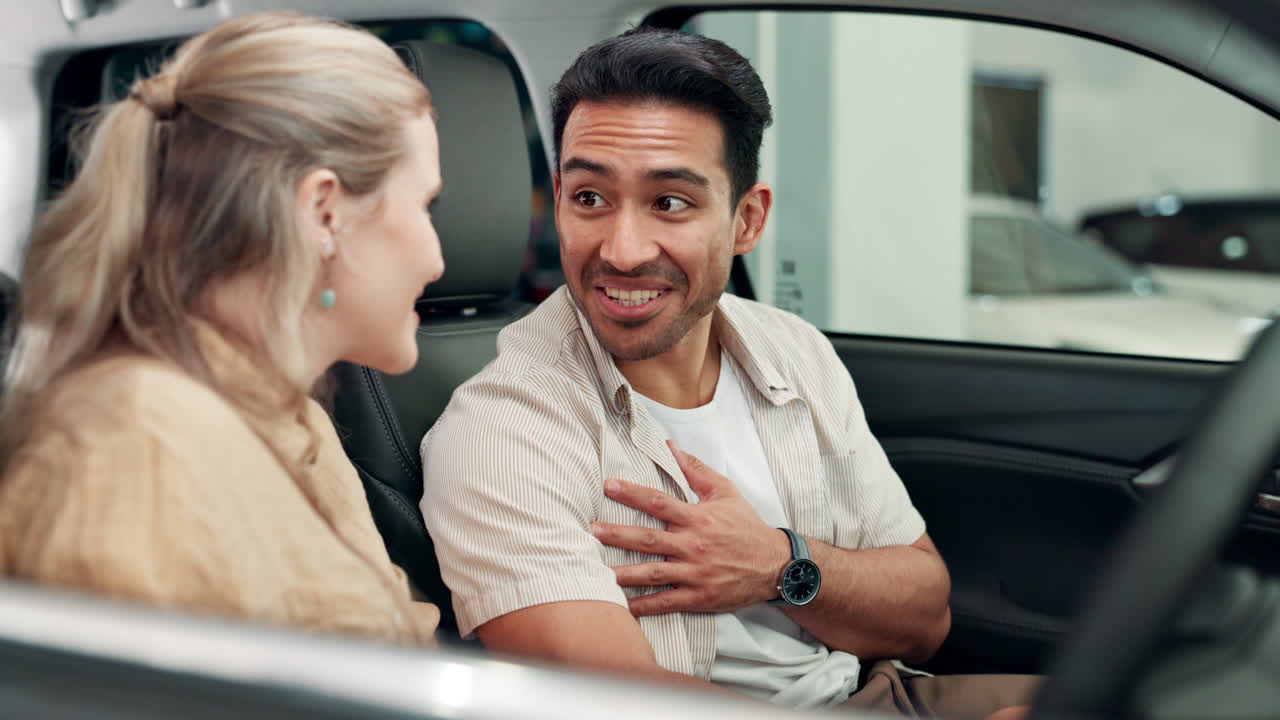 Couple inside a new car