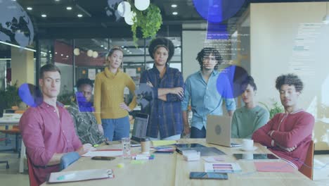 Animation-of-globes,-graphs-and-computer-language,-diverse-coworkers-looking-at-camera-in-office