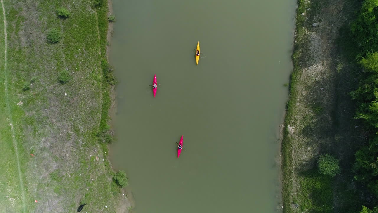 Kayaks traveling down river in Kosovo, Top Down Aerial