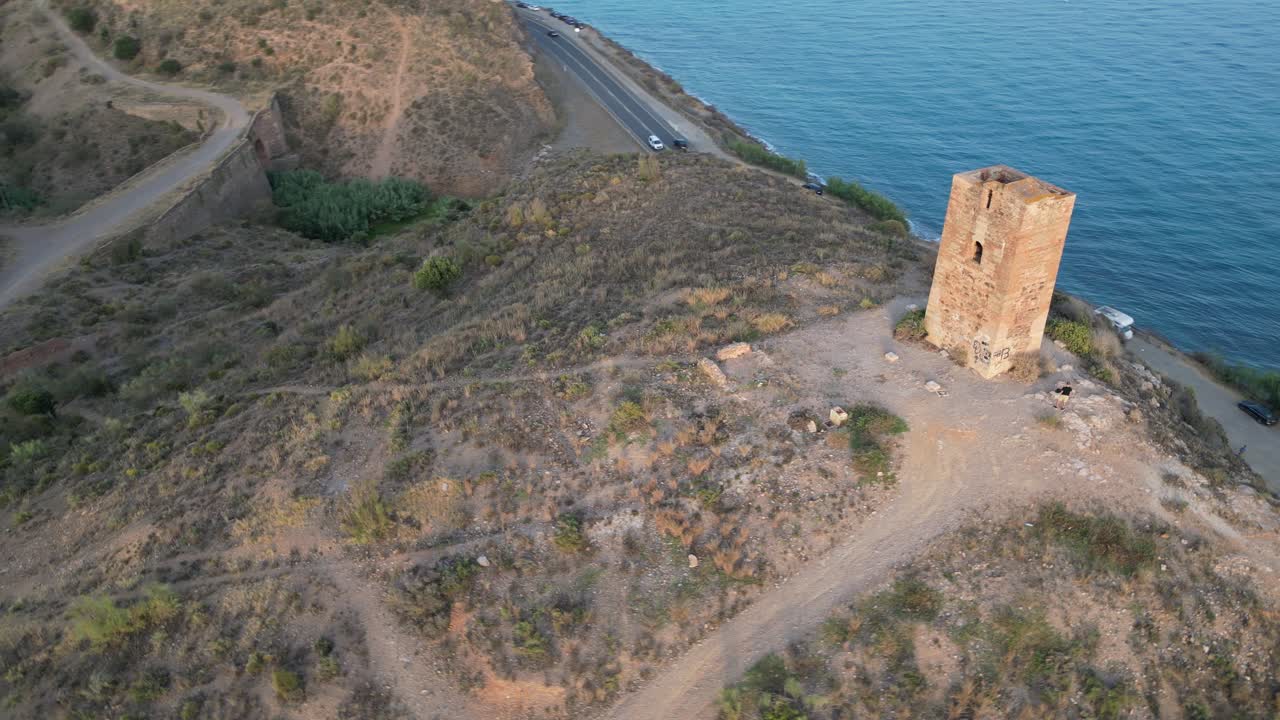 Experience the historic Tower of Jaral in Almayate Bajo from a mesmerizing drone's-eye view