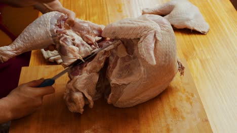 butchering turkey on wooden cut board