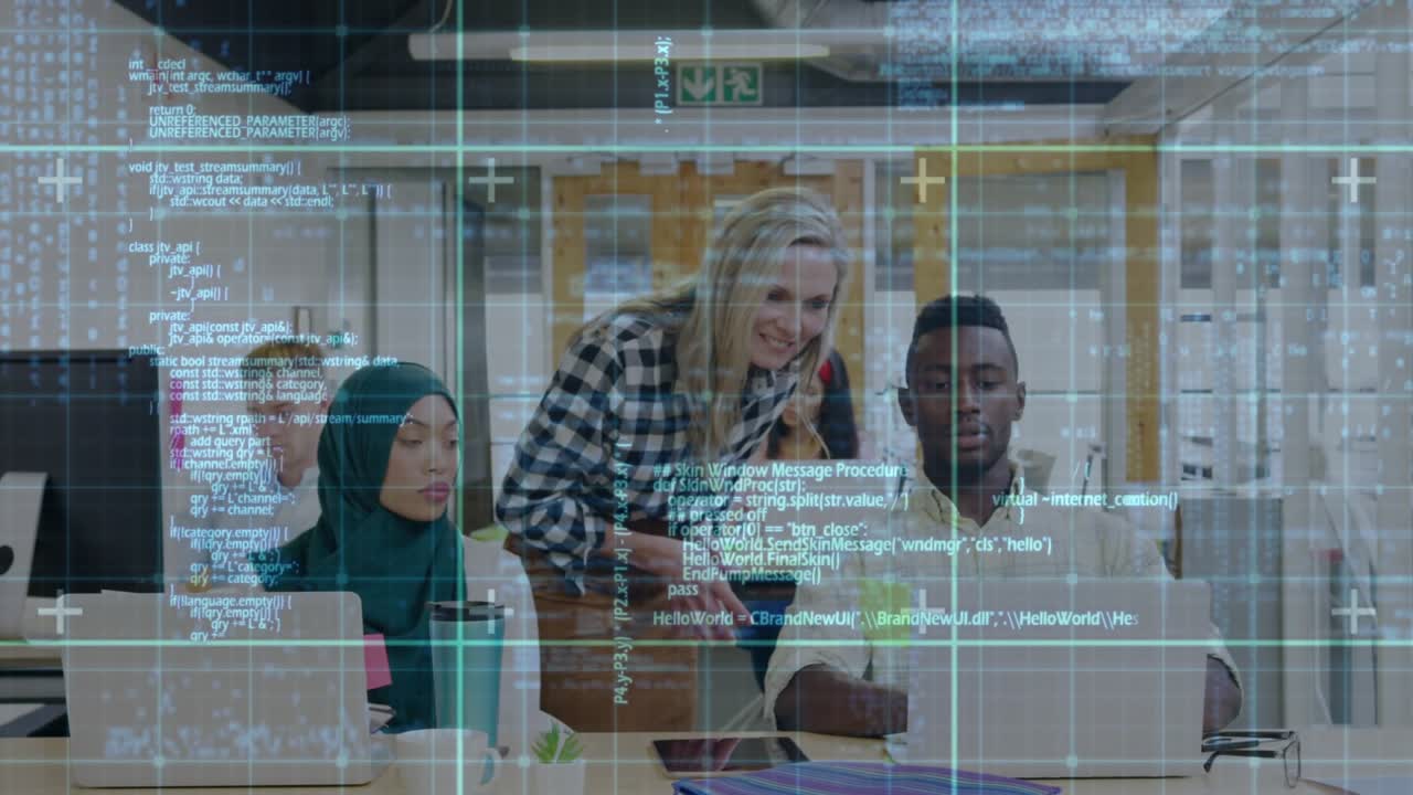 Female instructor entering room and guiding male student coding corrections for skill development