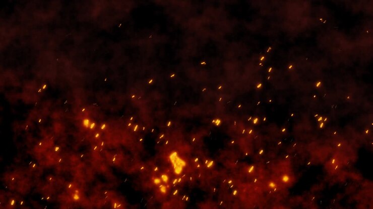Burning red hot flying sparks fire in the night sky. Beautiful abstract fiery orange glowing flying on black background in 4k.