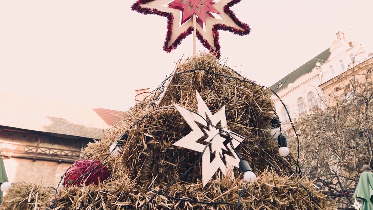 Christmas composition of hay and garlands.
