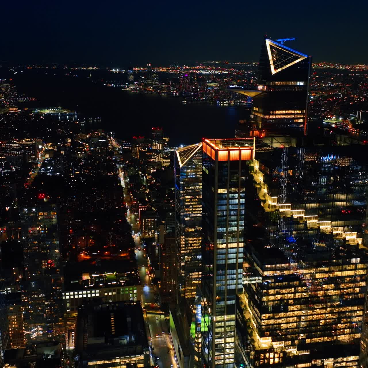 Rising above the splendid cityscape of New York. Night city view from drone footage