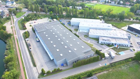 Aerial-view-of-warehouse-storages-or-industrial-factory-or-logistics-center-from-above