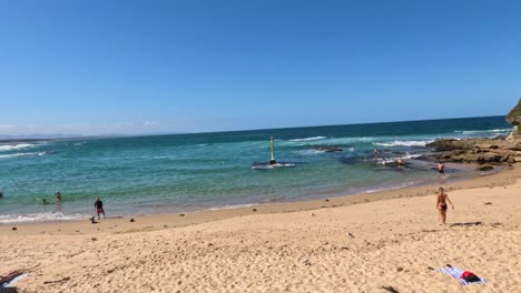 people enjoying a sunny beach day